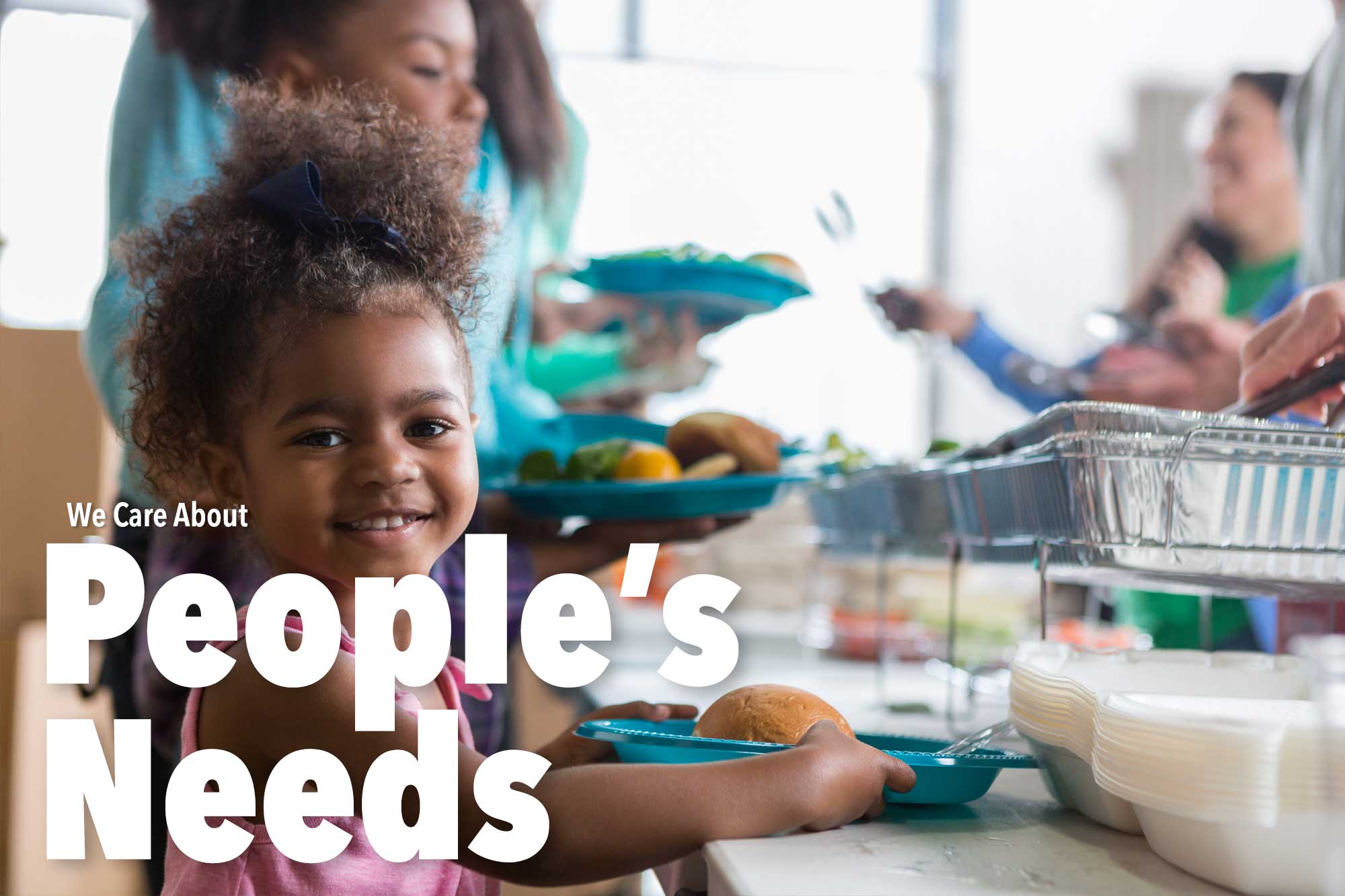 Smiling children at a soup kitchen event